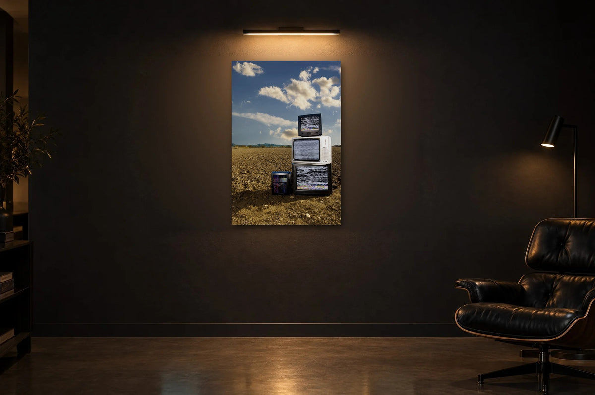 Television Project No. 10 — Cloud Cover — photo print shown in a dark gallery room under a picture light