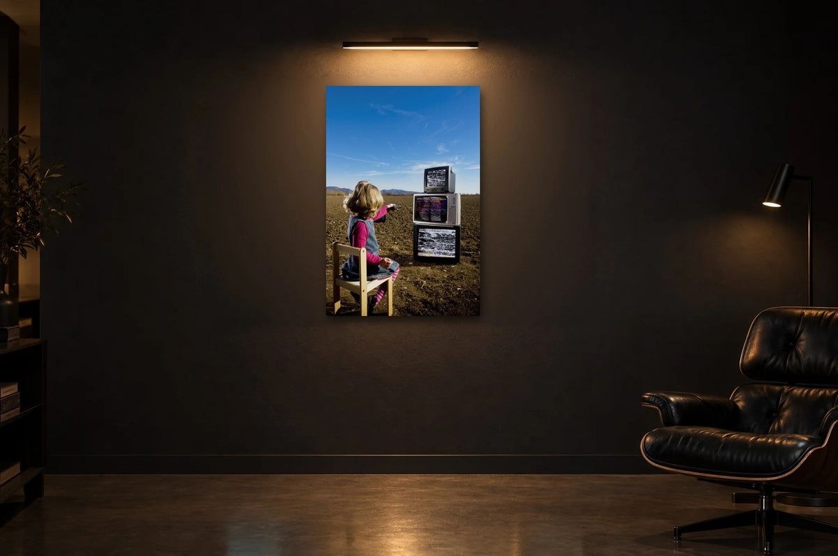 Television Project No. 11 — Remote Control — photo print shown in a dark gallery room under a picture light